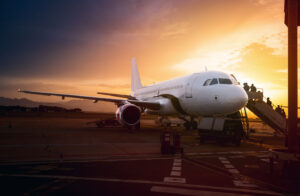 Boarding an airplane at sunset