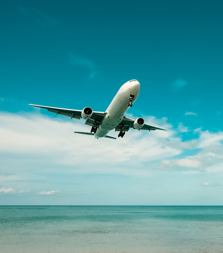 Airplane flying over the sea