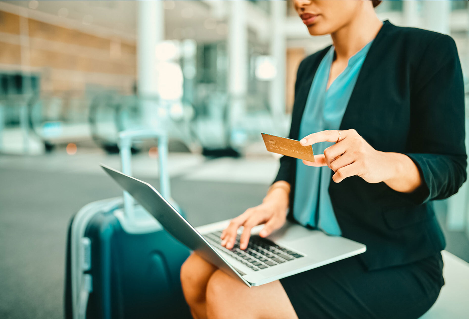 Traveller consulting a digital departure board at airport